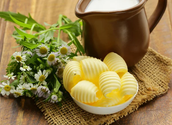 Fresh yellow dairy butter in a white bowl — Stock Photo, Image