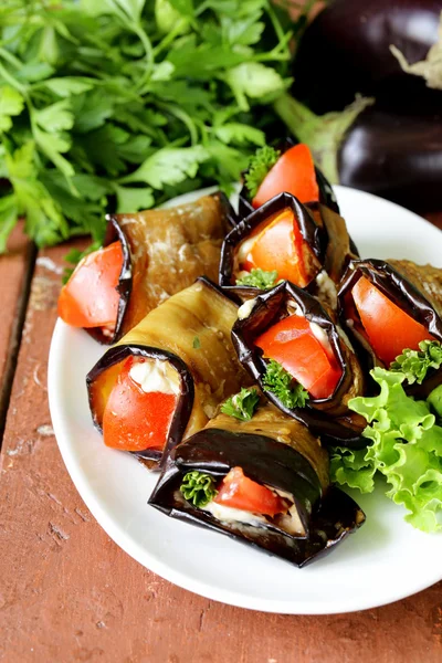 Vegetable saute fried eggplant rolls with tomatoes — Stock Photo, Image