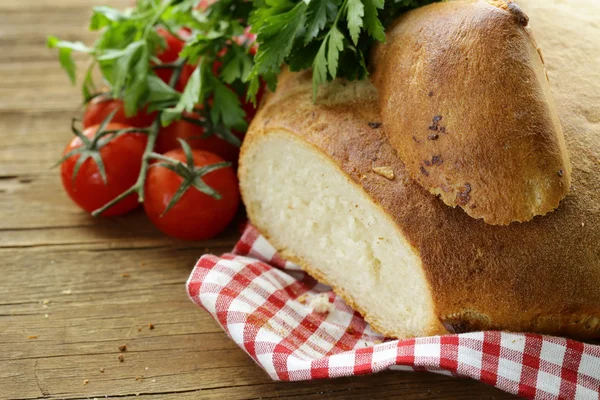 Traditional Italian ciabatta bread with tomatoes and herbs — Stock Photo, Image