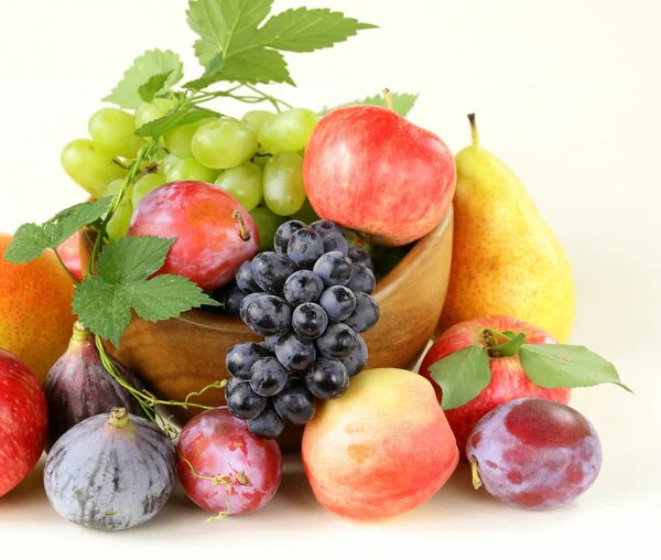 Assortment autumn harvest fruit (grapes, figs, apples, plums) — Stock Photo, Image