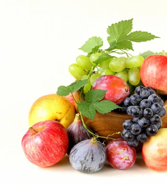 Assortment autumn harvest fruit (grapes, figs, apples, plums) — Stock Photo, Image