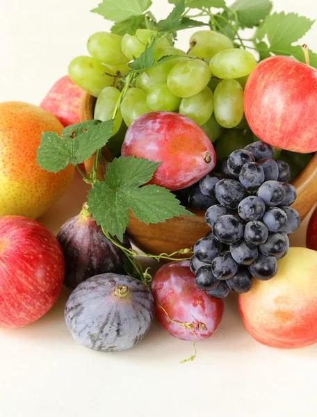 Assortment autumn harvest fruit (grapes, figs, apples, plums) — Stock Photo, Image