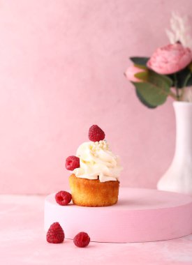 cupcake with cream and fresh berries