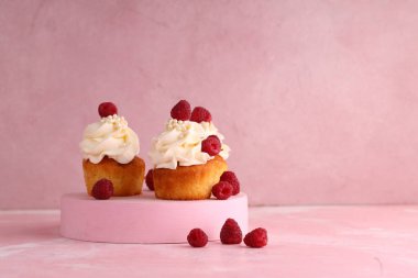cupcake with cream and fresh berries