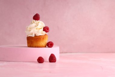 cupcake with cream and fresh berries