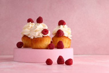 cupcake with cream and fresh berries