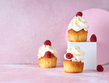 cupcake with cream and fresh berries