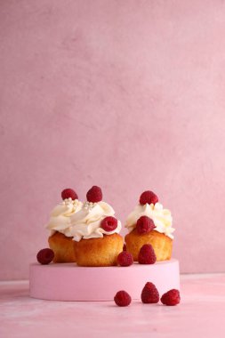 cupcake with cream and fresh berries