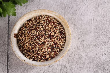 organic food quinoa in a ceramic bowl