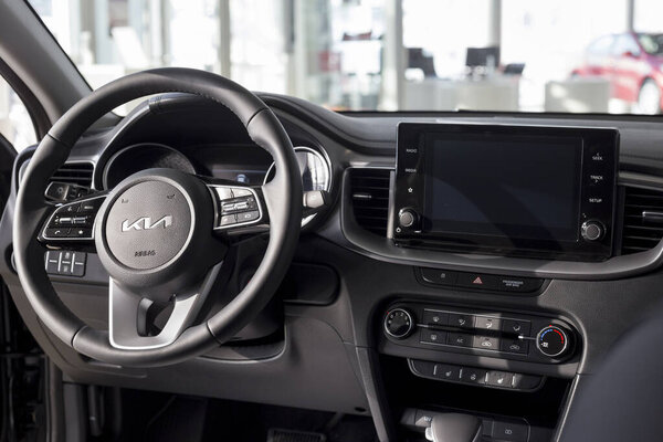 Россия, Ижевск - 17 февраля 2022 года: автосалон KIA. Интерьер нового современного универсала Ceed SW в салоне дилера. Известный мировой бренд.