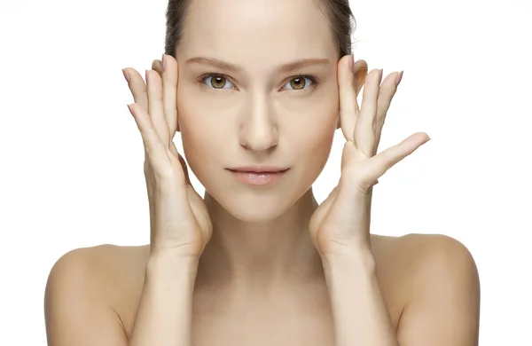 Close-up portrait of a beautiful young woman holding hands by her face — Stock Photo, Image