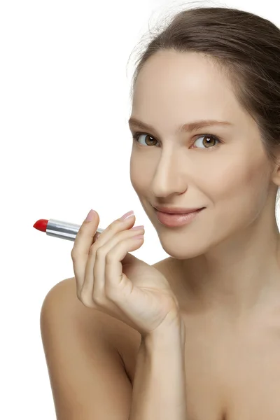 赤い口紅を適用する若い美しいモデル ストック画像