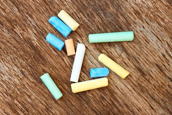 Colorful chalk on the old board — Stock Photo, Image