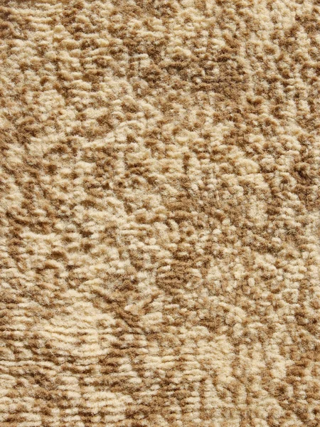 Beige flauschiger Fußbodenteppich — Stockfoto