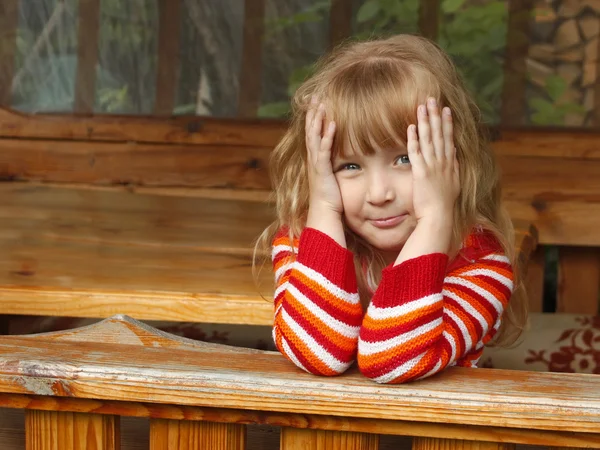 Little girl in wooden canopy outdoor — Stock Photo, Image