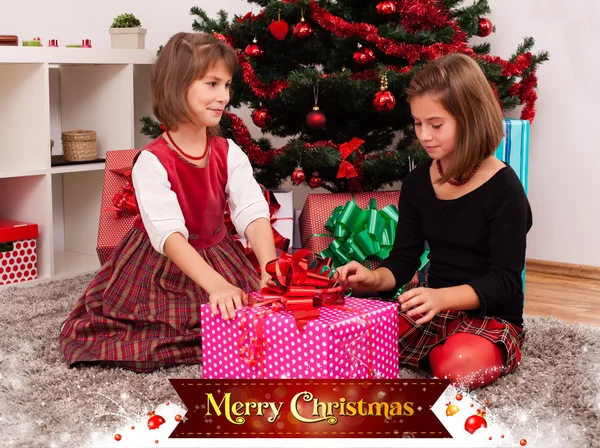 Kids with their christmas presents — Stock Photo, Image