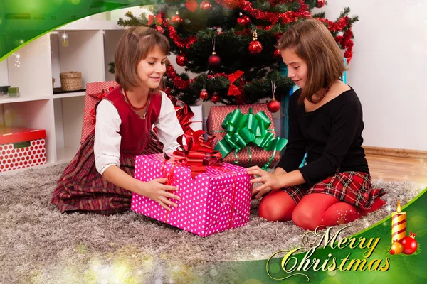 Kids with their christmas presents — Stock Photo, Image