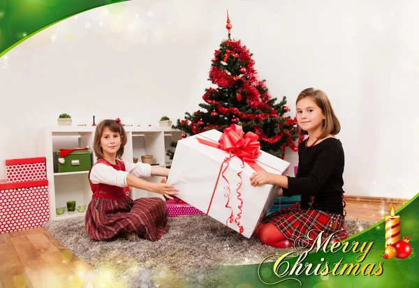 Kids with their christmas presents — Stock Photo, Image
