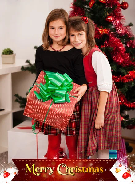 Děti s jejich vánoční dárky — Stock fotografie