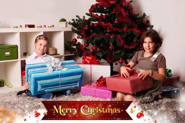 Kids with their christmas presents — Stock Photo, Image