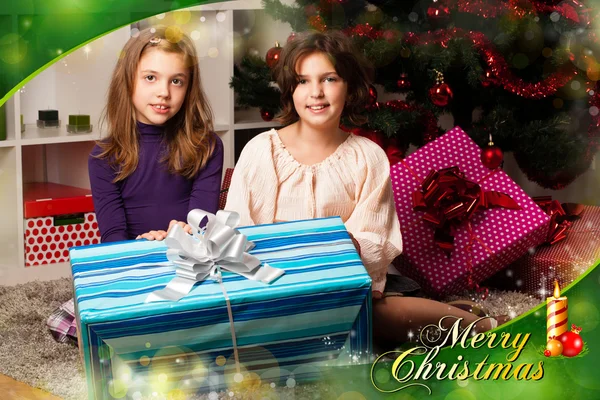 Kids with their christmas presents — Stock Photo, Image