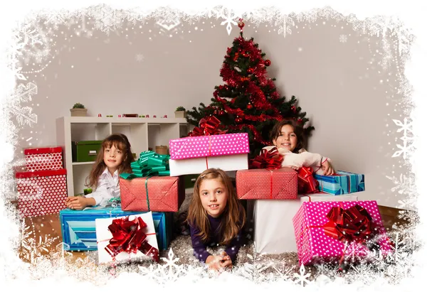 Kids with their christmas presents — Stock Photo, Image