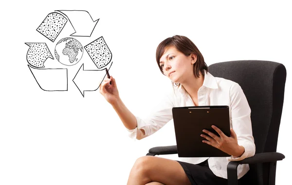 Young woman drawing recycle globe on whiteboard — Stock Photo, Image