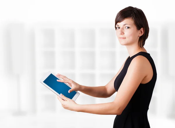 Young woman looking at modern tablet — Stock Photo, Image