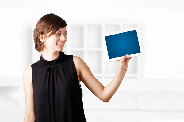 Young woman looking at modern tablet — Stock Photo, Image