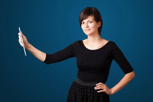 Young woman looking at modern tablet — Stock Photo, Image