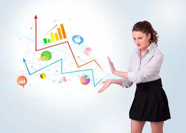 Young business woman presenting colorful charts and diagrams — Stock Photo, Image