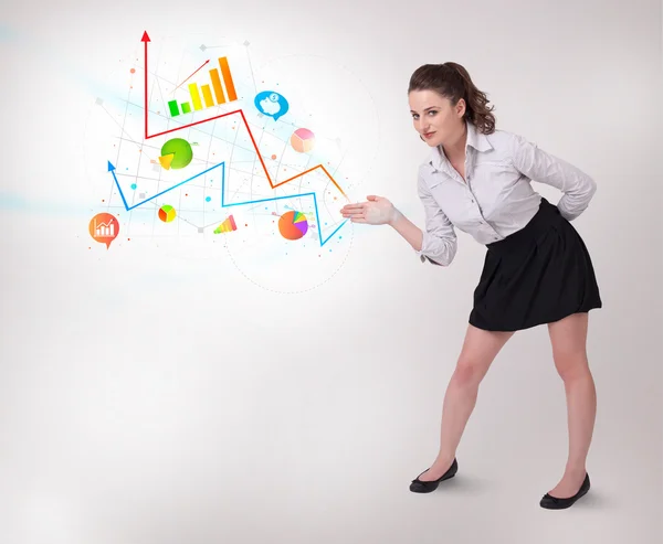 Young business woman presenting colorful charts and diagrams — Stock Photo, Image