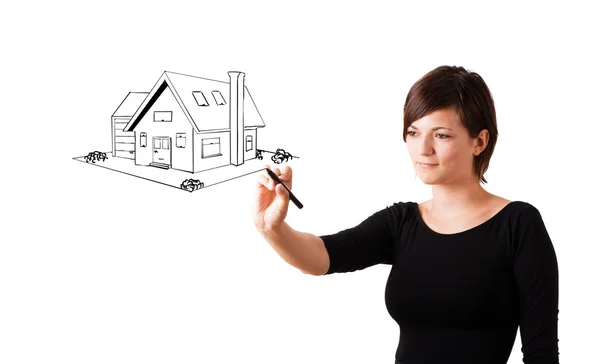Jonge vrouw een huis puttend uit whiteboard — Stockfoto