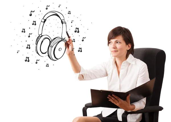 Ragazza disegno cuffie e note musicali — Foto Stock