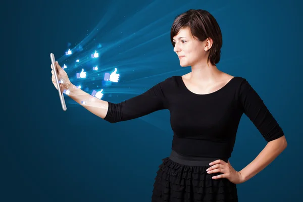 Young woman looking at modern tablet with abstract lights and so — Stock Photo, Image