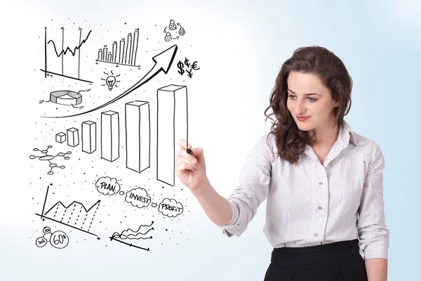 Young business woman drawing diagrams on whiteboard — Stock Photo, Image