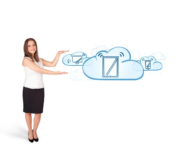 Young woman presenting modern devices in clouds — Stock Photo, Image