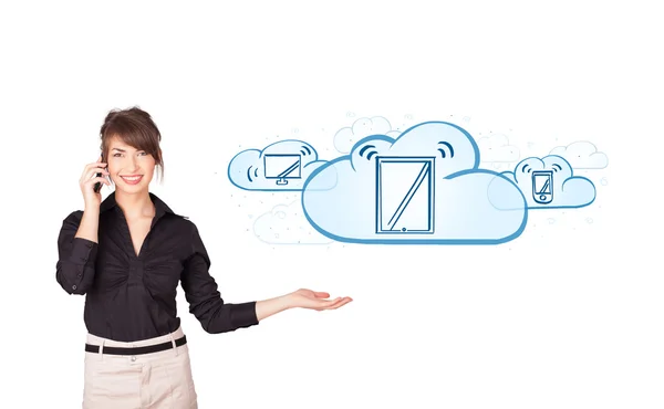 Young woman presenting modern devices in clouds — Stock Photo, Image