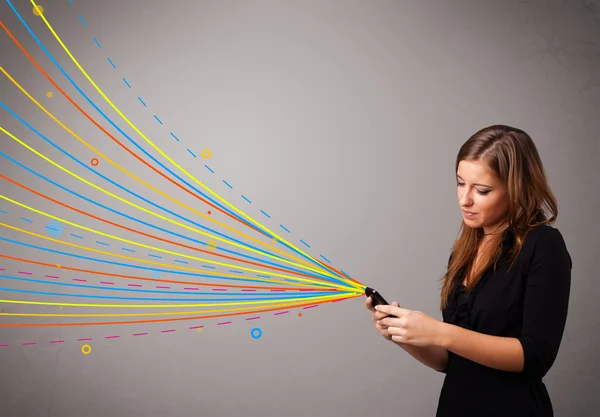 Happy girl holding a phone with colorful abstract lines — Stock Photo, Image