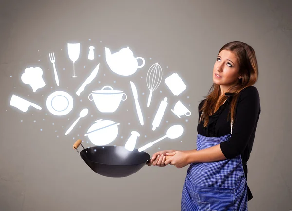 Jovem com ícones de acessórios de cozinha — Fotografia de Stock