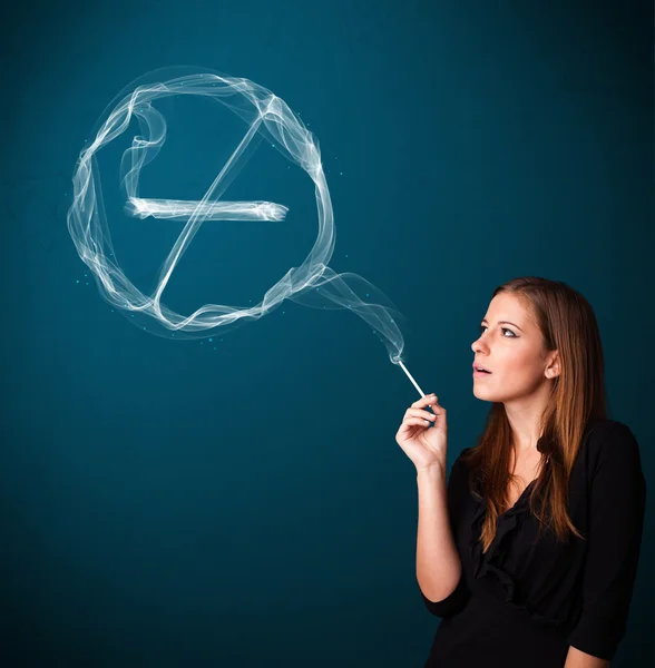 Young lady smoking unhealthy cigarette with no smoking sign — Stock Photo, Image