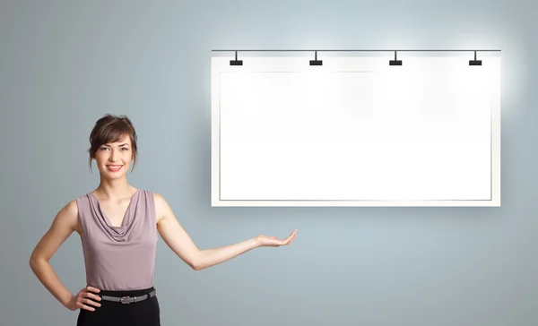 Young woman presenting modern copy space — Stock Photo, Image