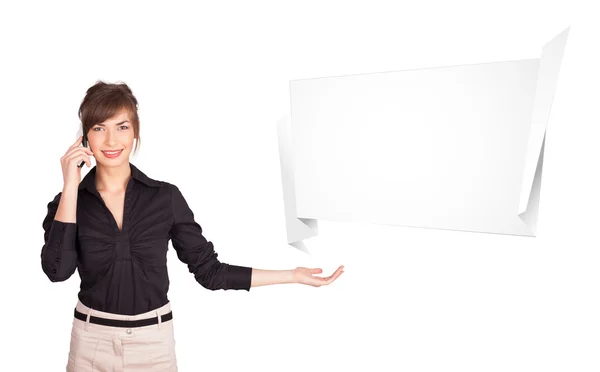 Young woman presenting abstract origami copy space — Stock Photo, Image