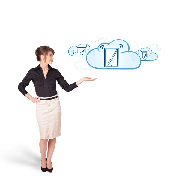 Young woman presenting modern devices in clouds — Stock Photo, Image