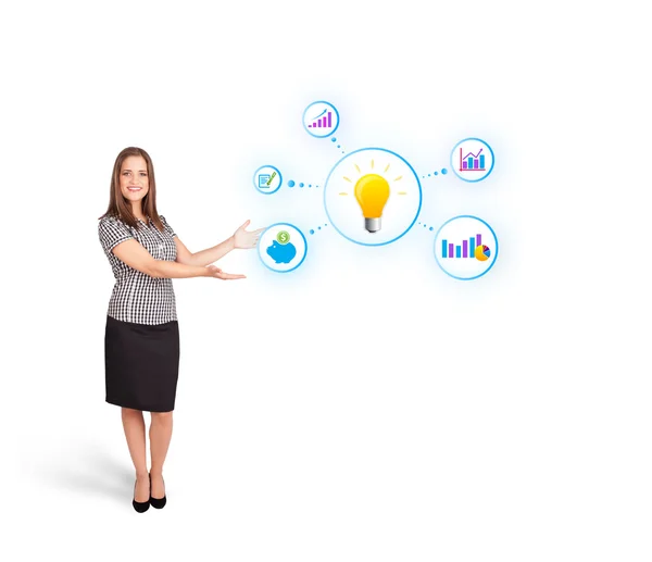 Young woman presenting light bulb with colorful graphs and diagr — Stock Photo, Image