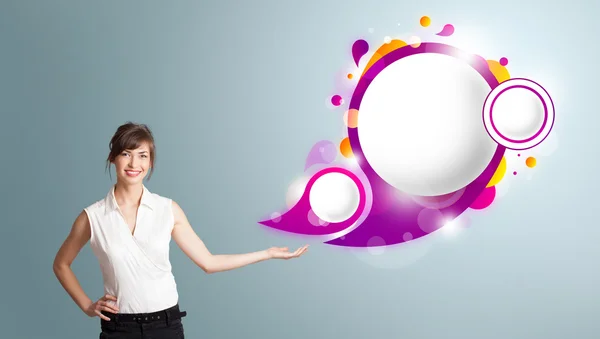 Attractive woman presenting abstract speech bubble copy space — Stock Photo, Image