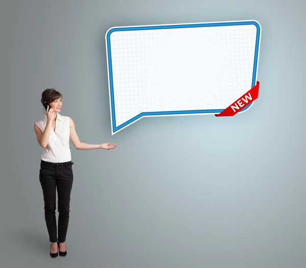 Young woman standing next to a modern speech bubble copy space a — Stock Photo, Image