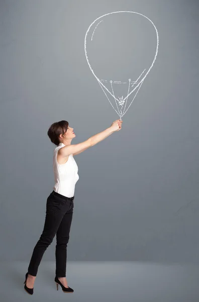 Mooie vrouw met ballon tekening — Stockfoto