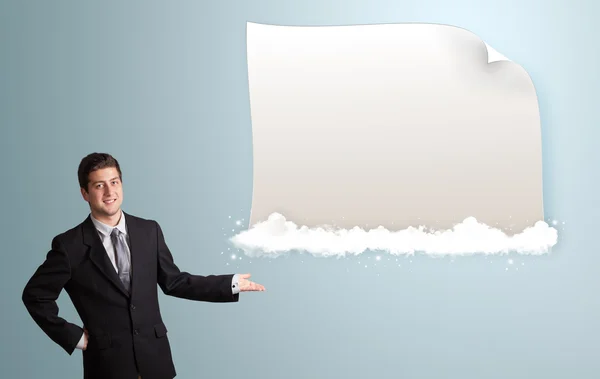 Attractive man presenting modern copy space on clouds — Stock Photo, Image