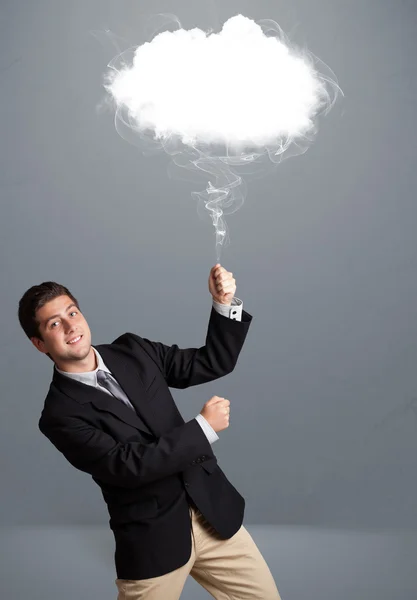 Young man holding cloud — Stock Photo, Image